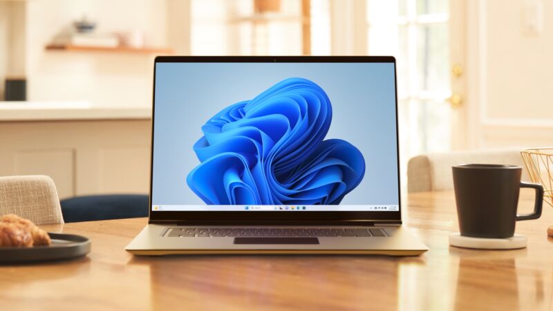 A laptop PC running Windows 11 sitting next to a coffee mug.